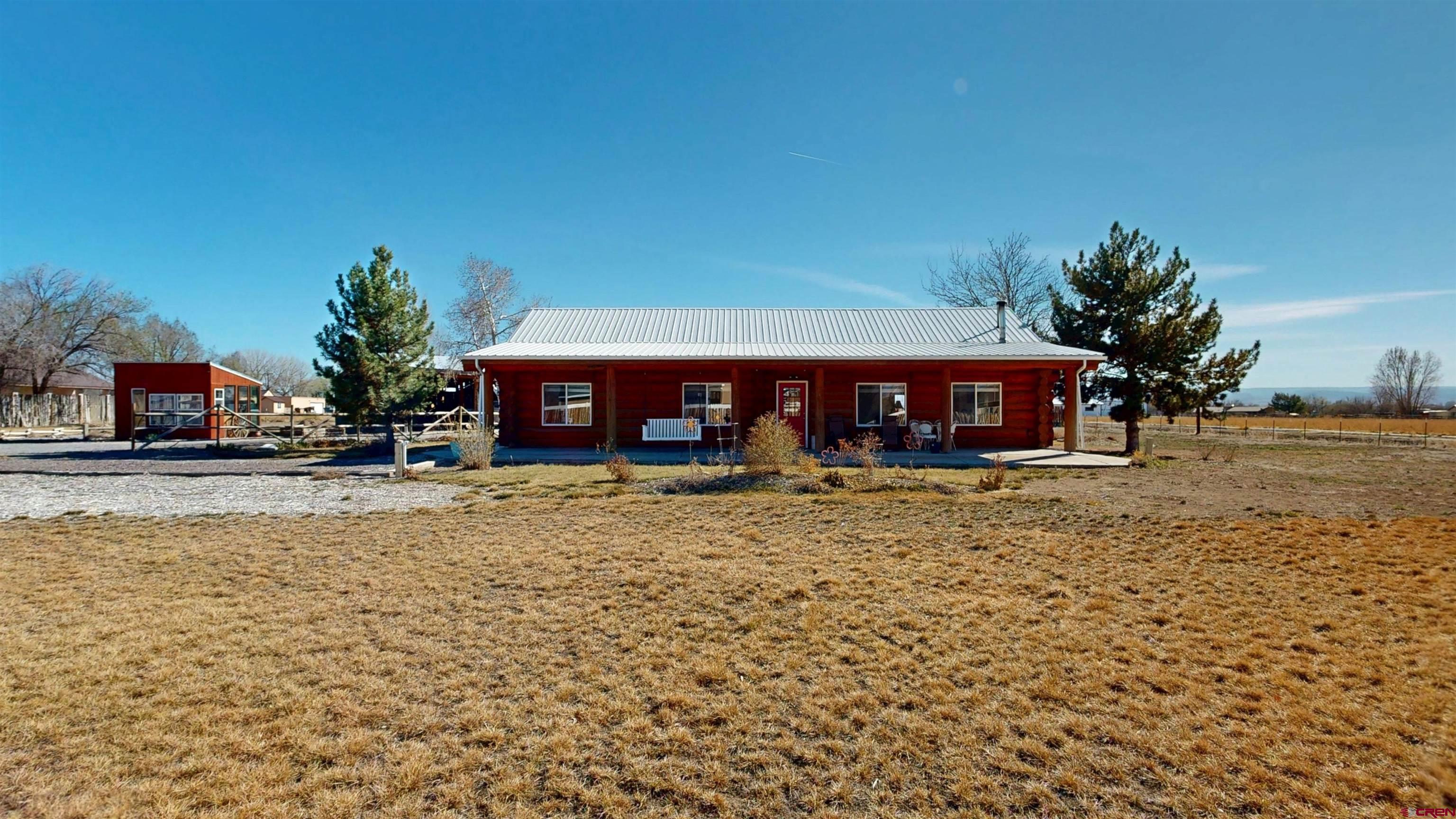 2083 Pioneer Road Delta, CO 81416 - Photo 4 of 43 a front view of a house with a yard