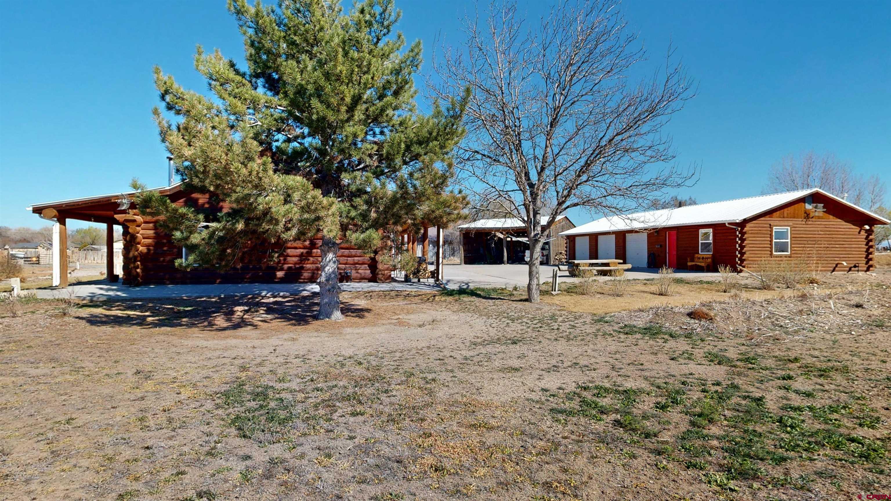 2083 Pioneer Road Delta, CO 81416 - Photo 41 of 43 a front view of a house with a yard