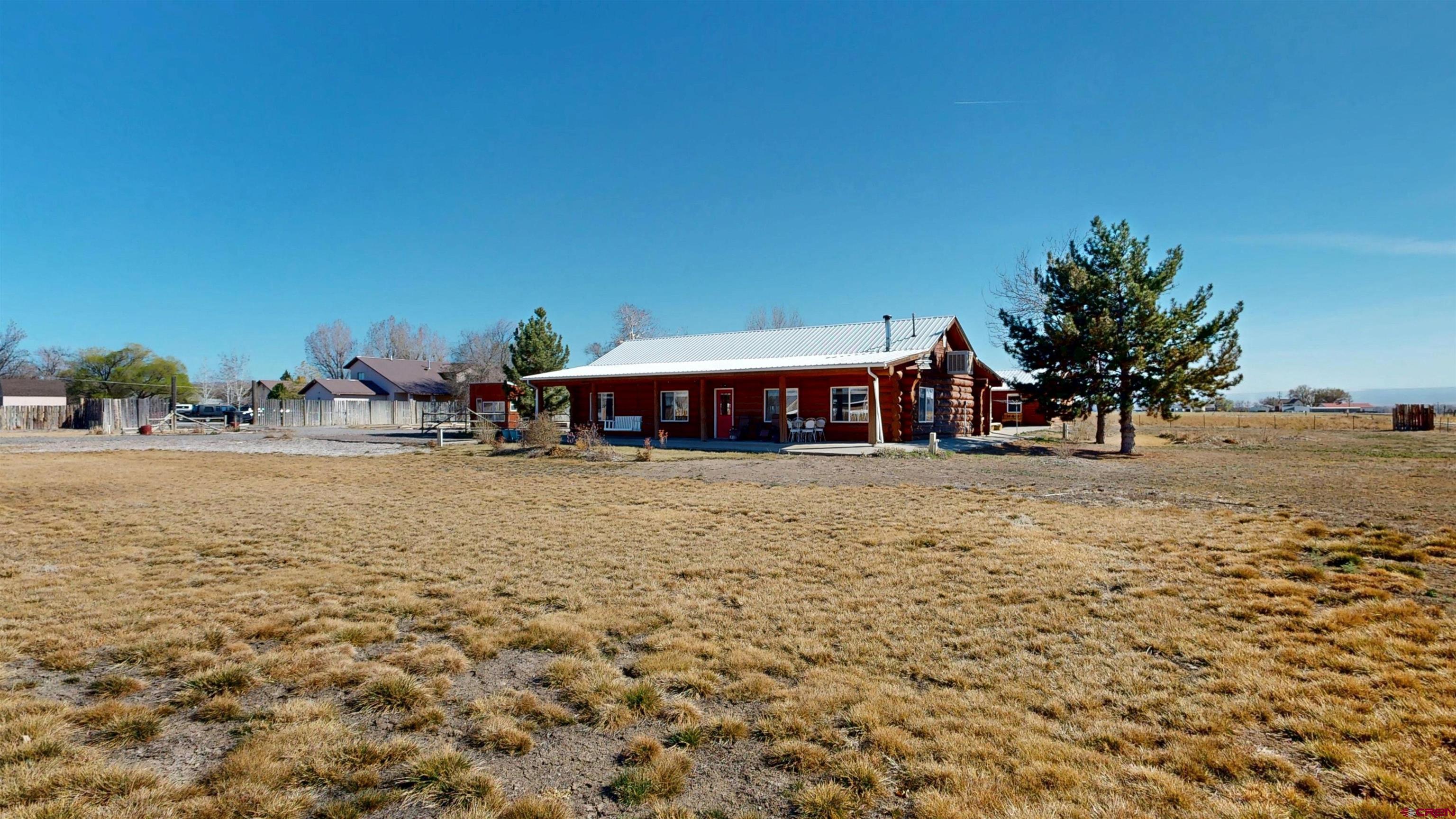 2083 Pioneer Road Delta, CO 81416 - Photo 42 of 43 a view of house with outdoor space and sitting area