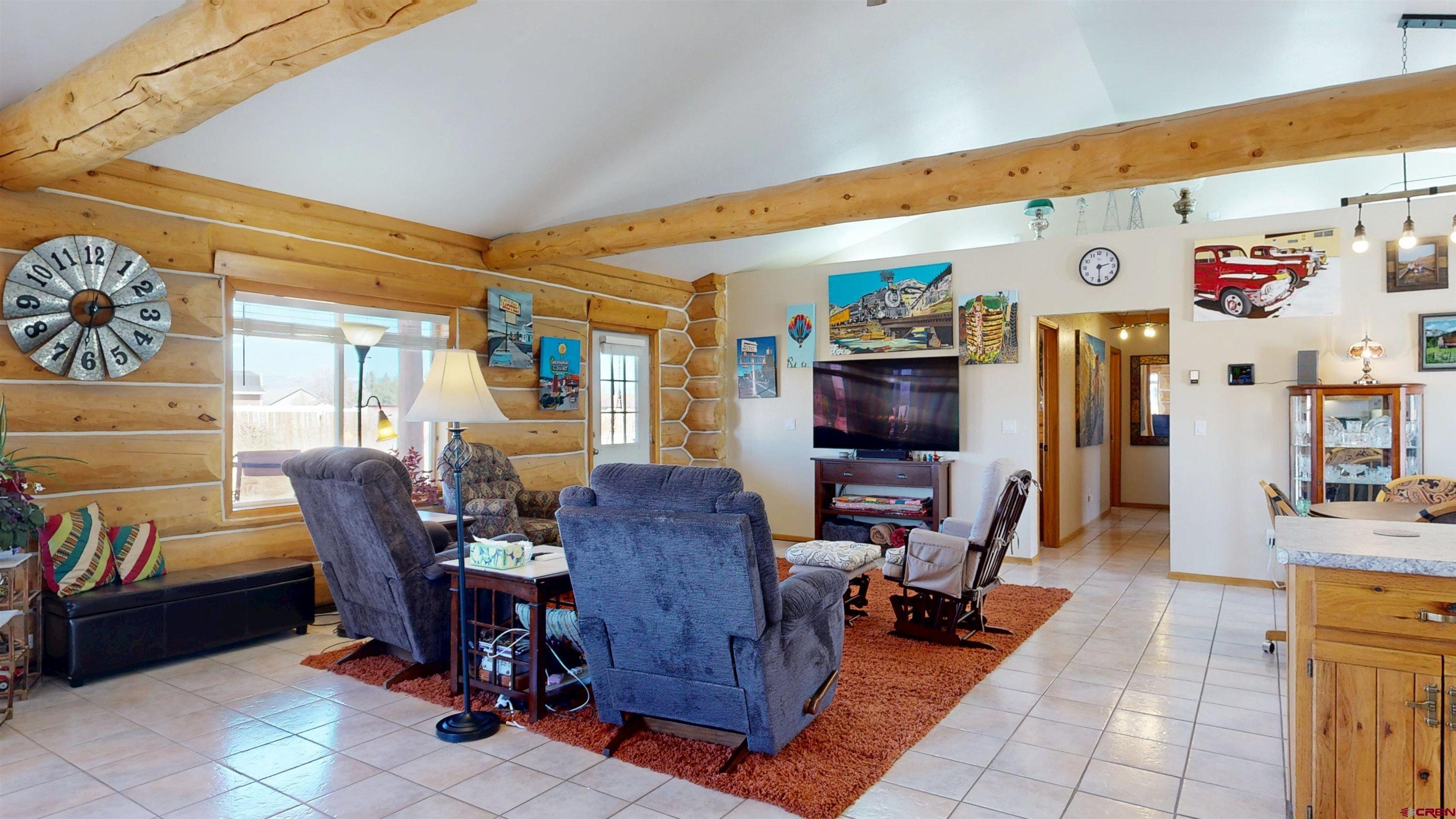 2083 Pioneer Road Delta, CO 81416 - Photo 9 of 43 a living room with furniture and a flat screen tv