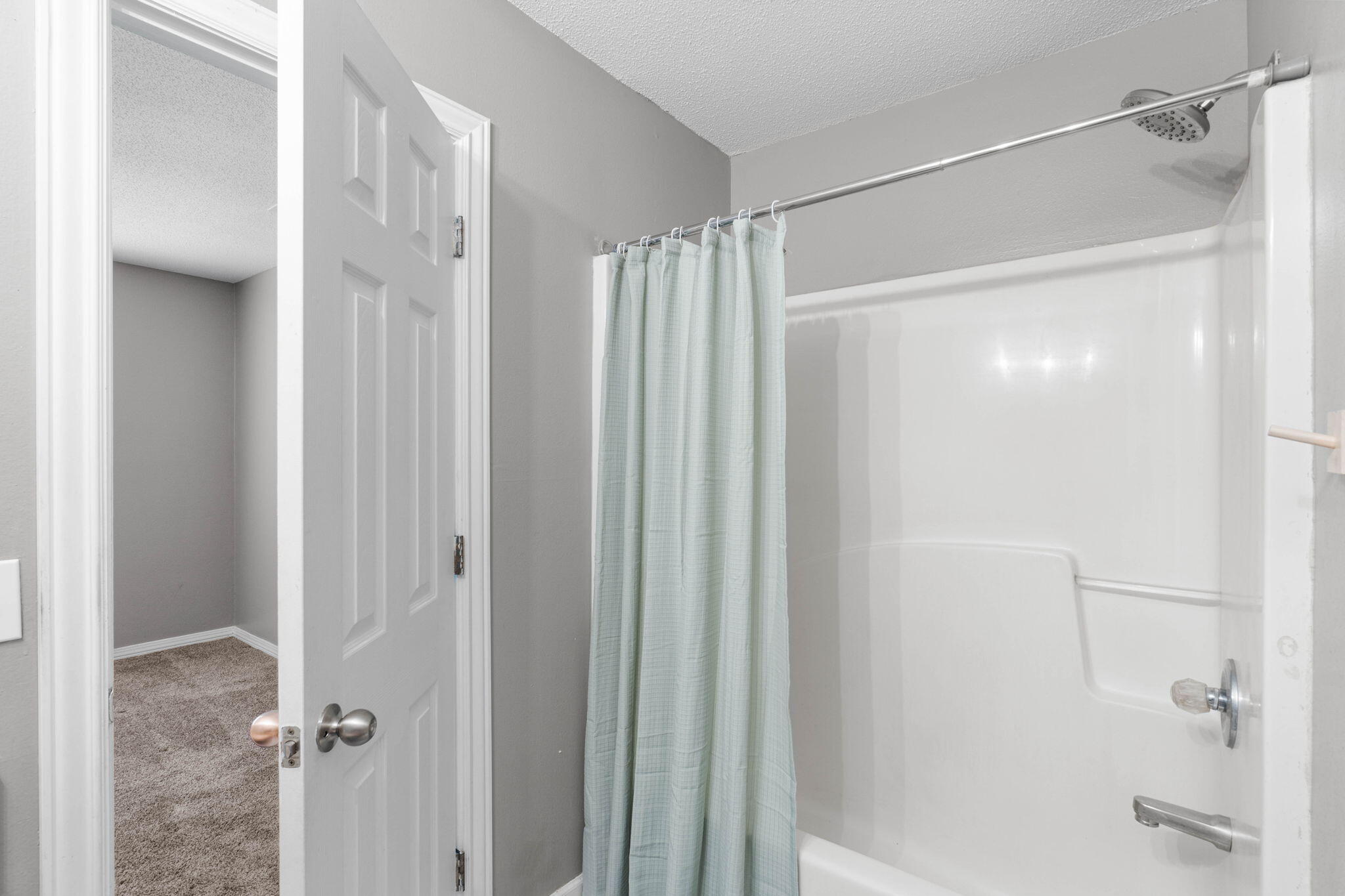 2517 Sunset Drive Crestview, FL 32536 - Photo 24 of 34 a bathroom with a glass shower door