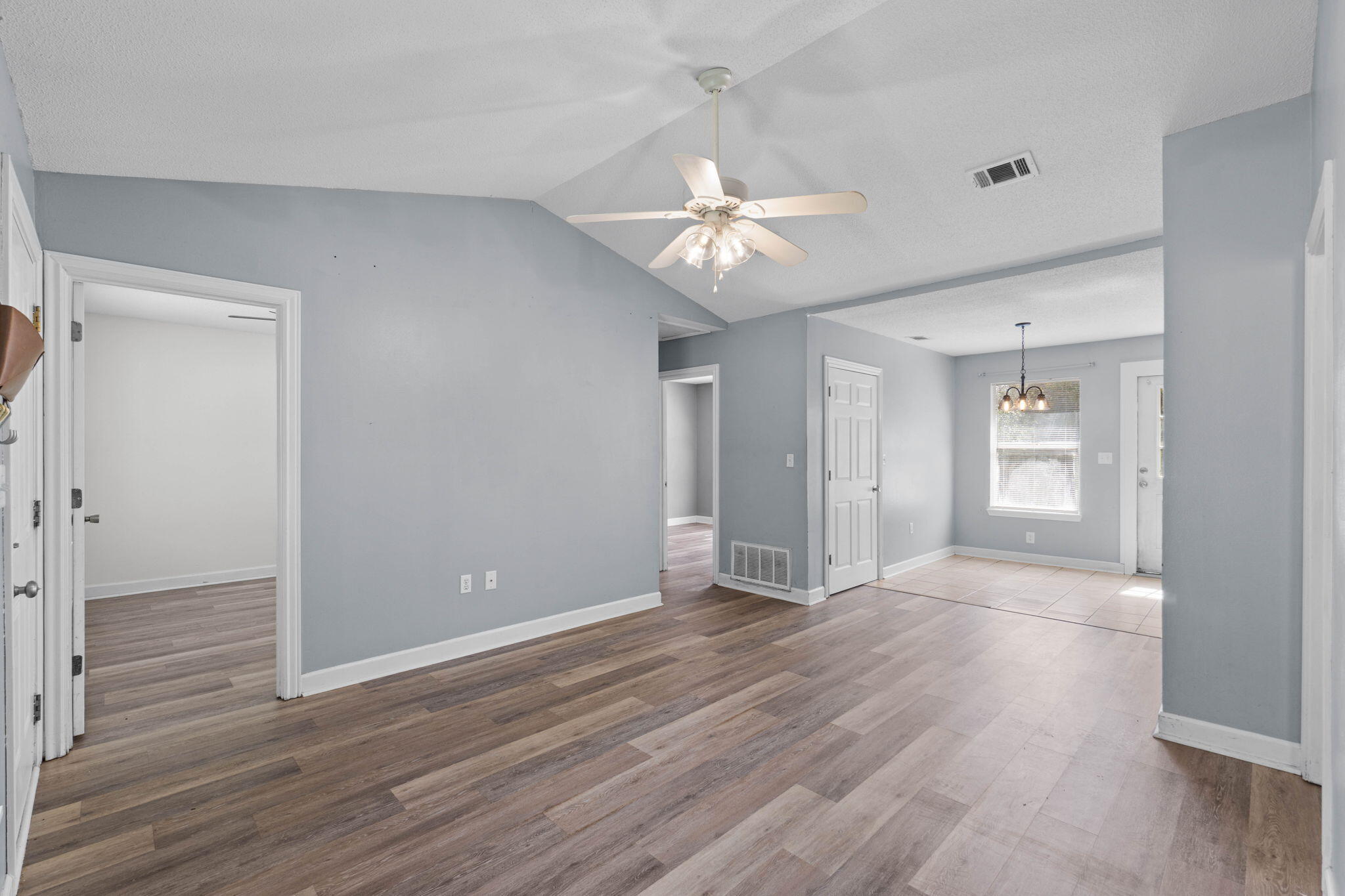 2517 Sunset Drive Crestview, FL 32536 - Photo 7 of 34 a view of an empty room with wooden floor