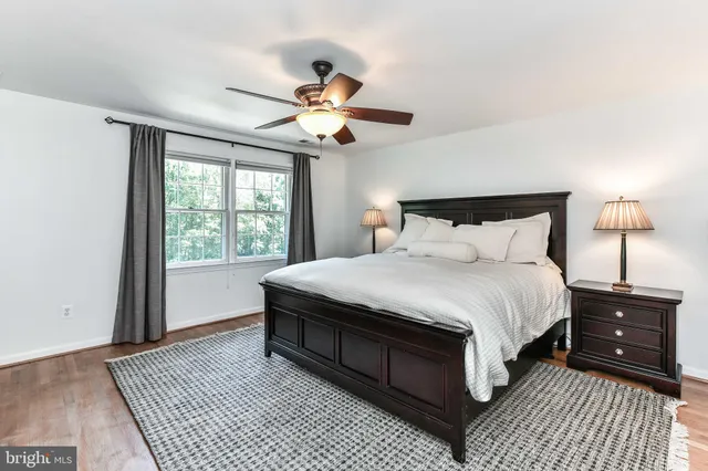 a bathroom with a glass shower door and a sink