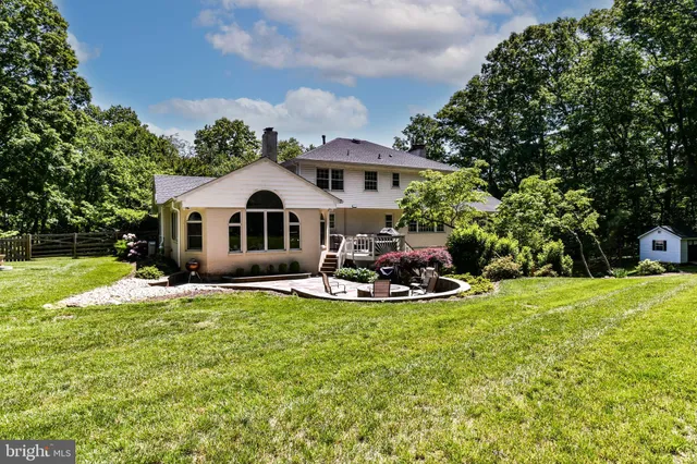 a view of a yard with a table and chair
