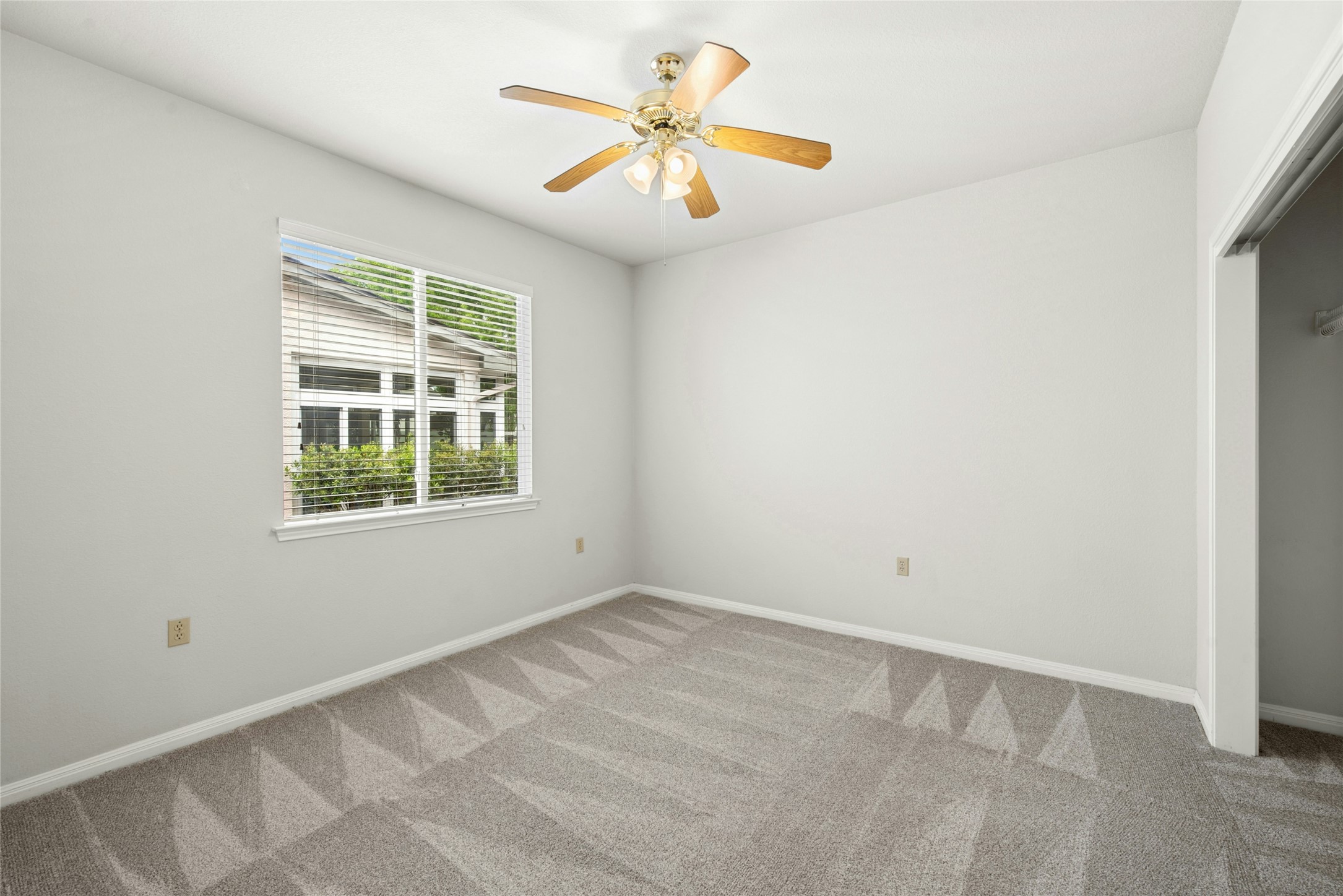 122 Harness Lane Georgetown, TX 78633 - Photo 25 of 40 an empty room with a window and a fan