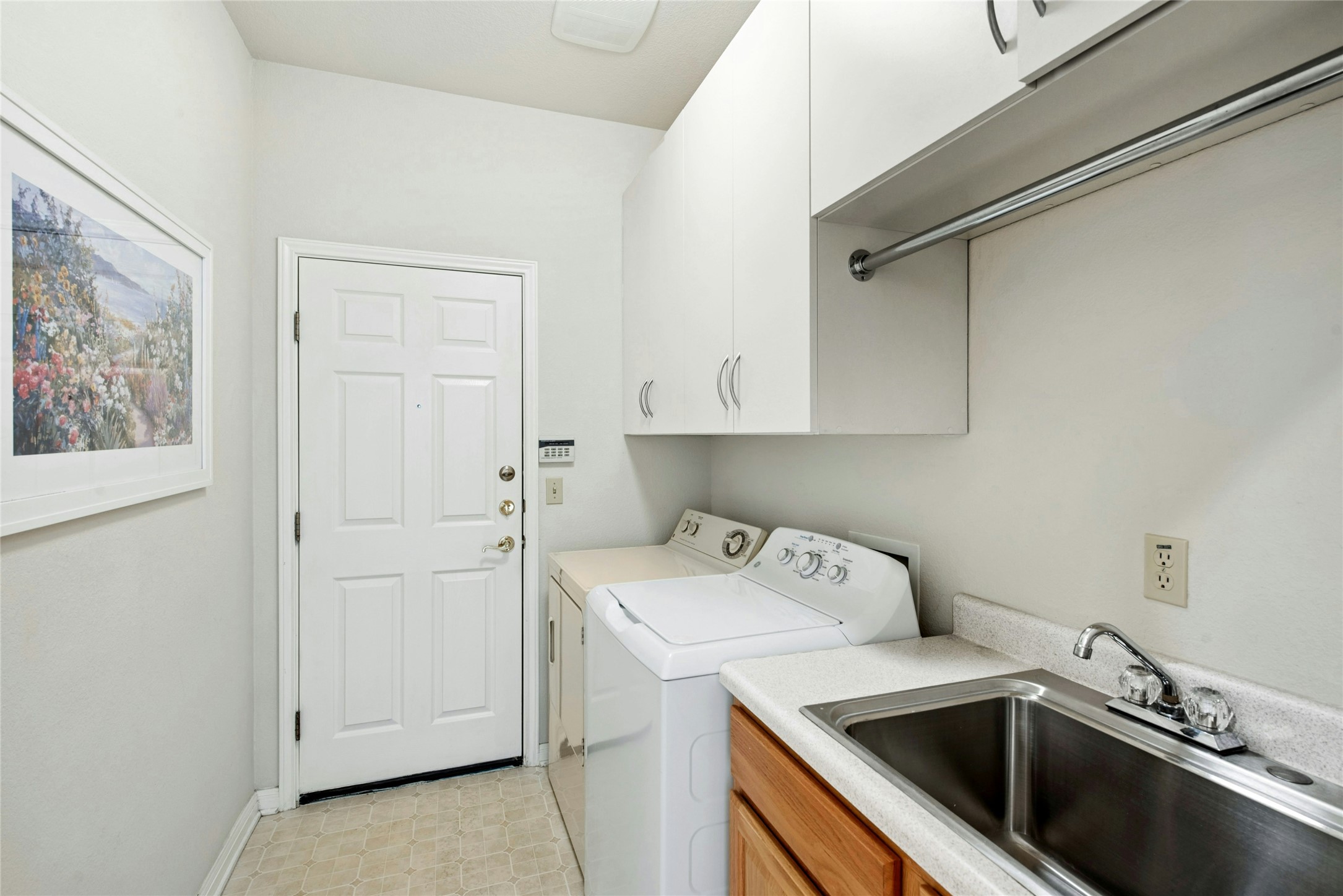 122 Harness Lane Georgetown, TX 78633 - Photo 28 of 40 a utility room with sink dryer and washer
