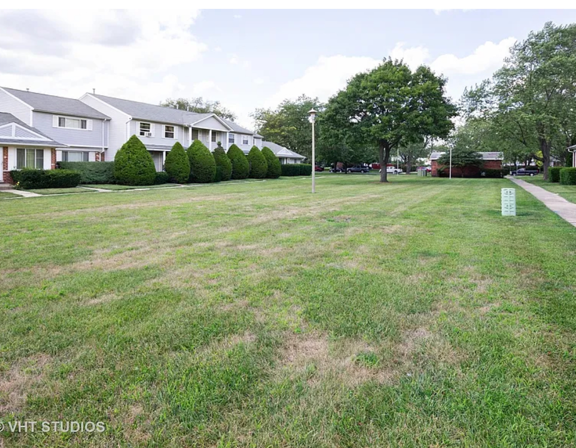 Undisclosed Address Bolingbrook, IL 60440 - Photo 2 of 15 a view of a green field with house in the background