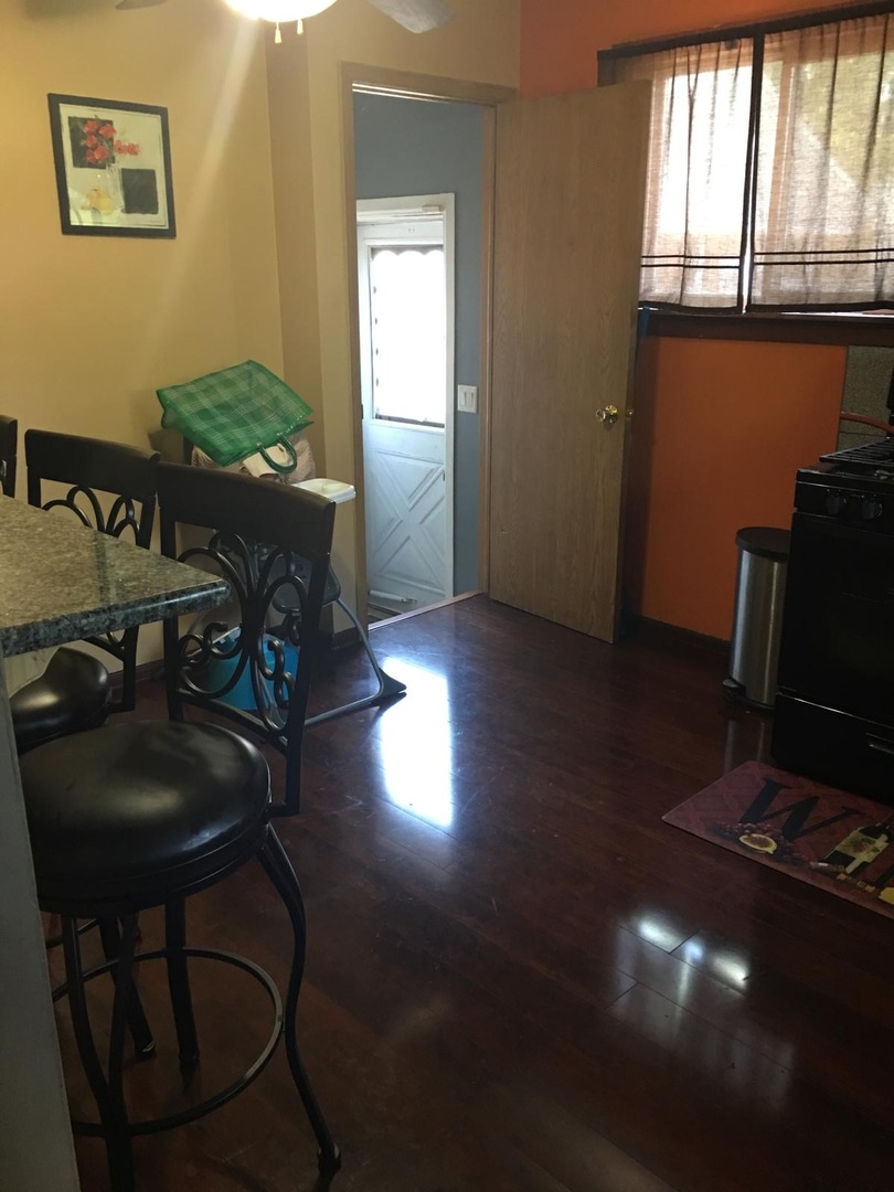 Undisclosed Address Bolingbrook, IL 60440 - Photo 4 of 15 a living room with furniture and a flat screen tv