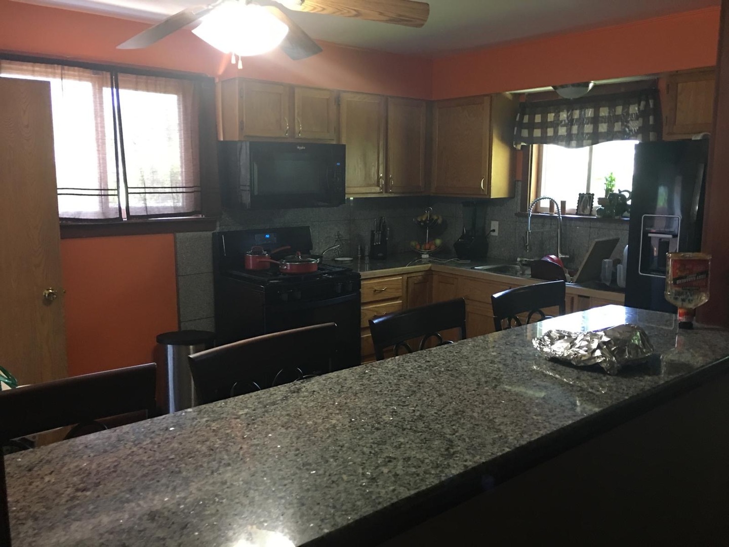 Undisclosed Address Bolingbrook, IL 60440 - Photo 6 of 15 a kitchen with granite countertop a sink cabinets and window