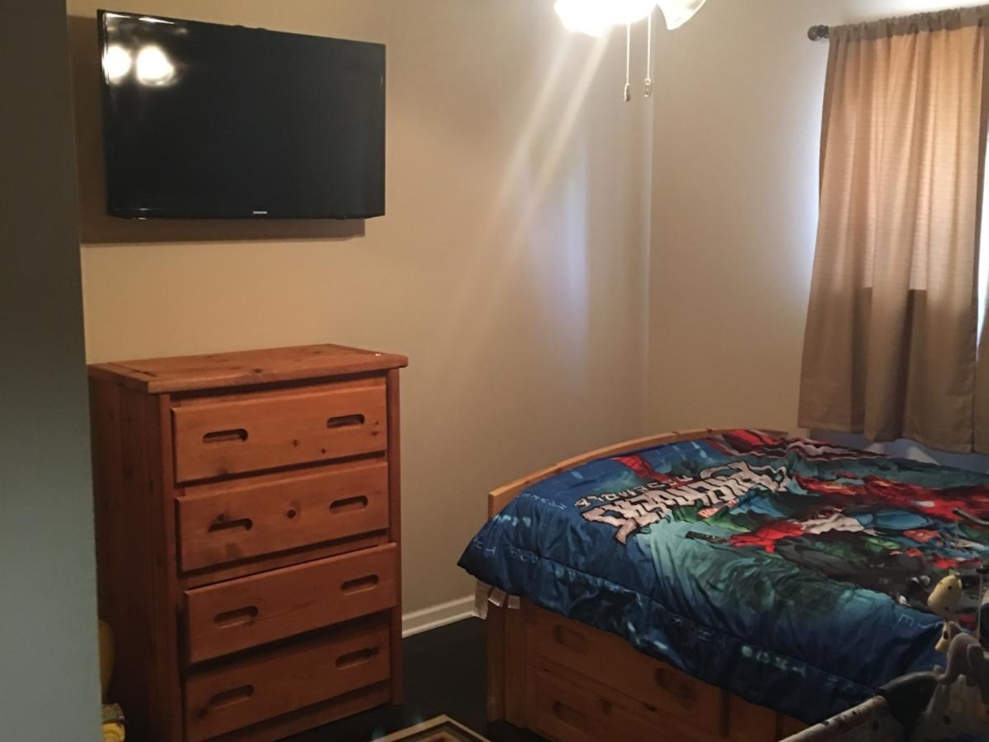 Undisclosed Address Bolingbrook, IL 60440 - Photo 10 of 15 a bedroom with a bed and a flat screen tv