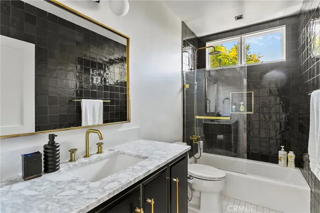 a kitchen with a sink and a stove