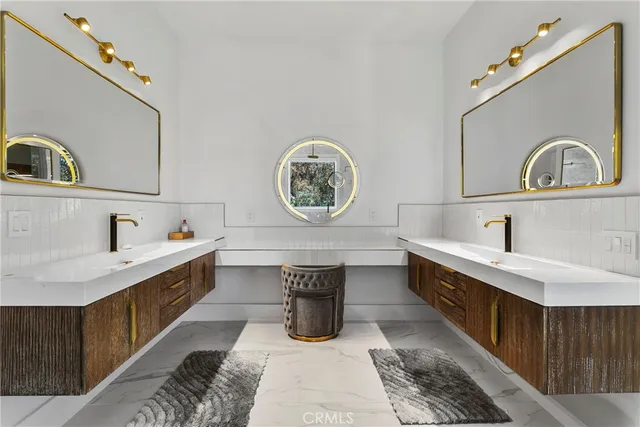 a spacious bathroom with a tub sink and mirror