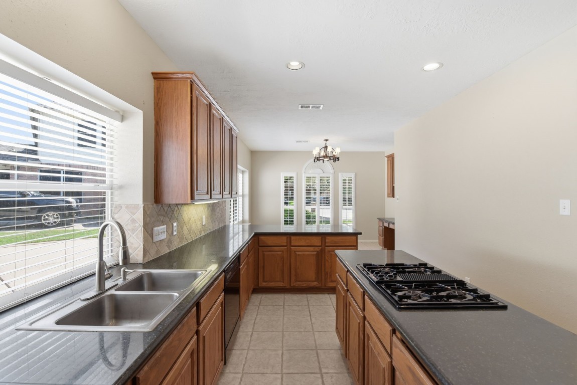 3414 Hackberry Court Spring, TX 77388 - Photo 17 of 50 Large double stainless steel sink. Gas cook top in the island!