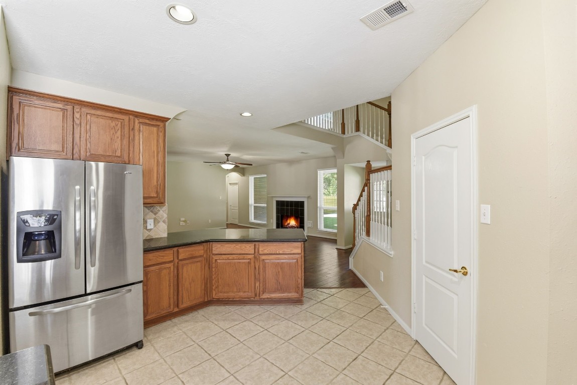 3414 Hackberry Court Spring, TX 77388 - Photo 18 of 50 Another bar area that is completely open to the family room! This kitchen layout is an entertainer's dream! Stainless steel refrigerator conveys.