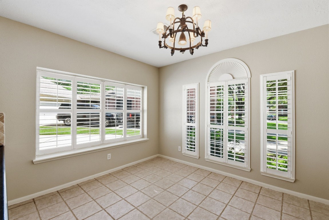3414 Hackberry Court Spring, TX 77388 - Photo 20 of 50 The breakfast room that is open to the kitchen has so many great windows with white wooden shutters! Fresh paint!