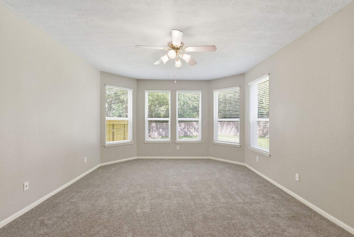 3414 Hackberry Court Spring, TX 77388 - Photo 23 of 50 There is a great area by the windows to have a reading nook or a sitting area in this primary bedroom.