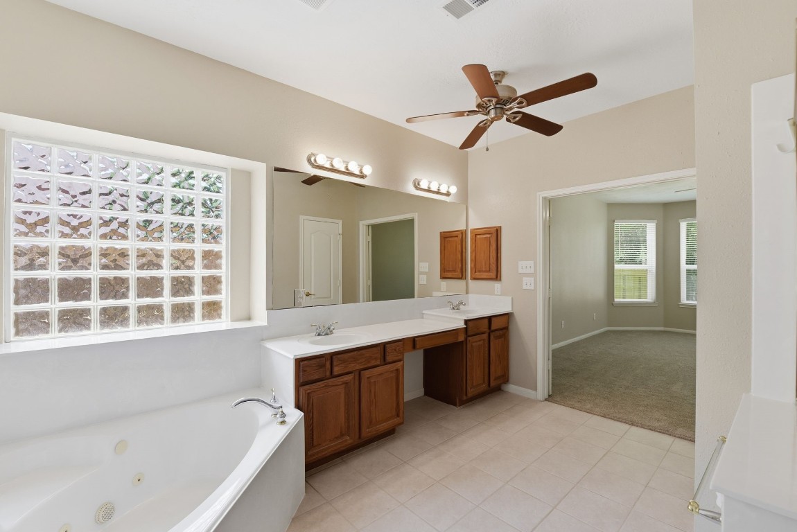 3414 Hackberry Court Spring, TX 77388 - Photo 26 of 50 A jetted tub and separate shower, a ceiling fan to keep things cool, tile floors, fresh paint!