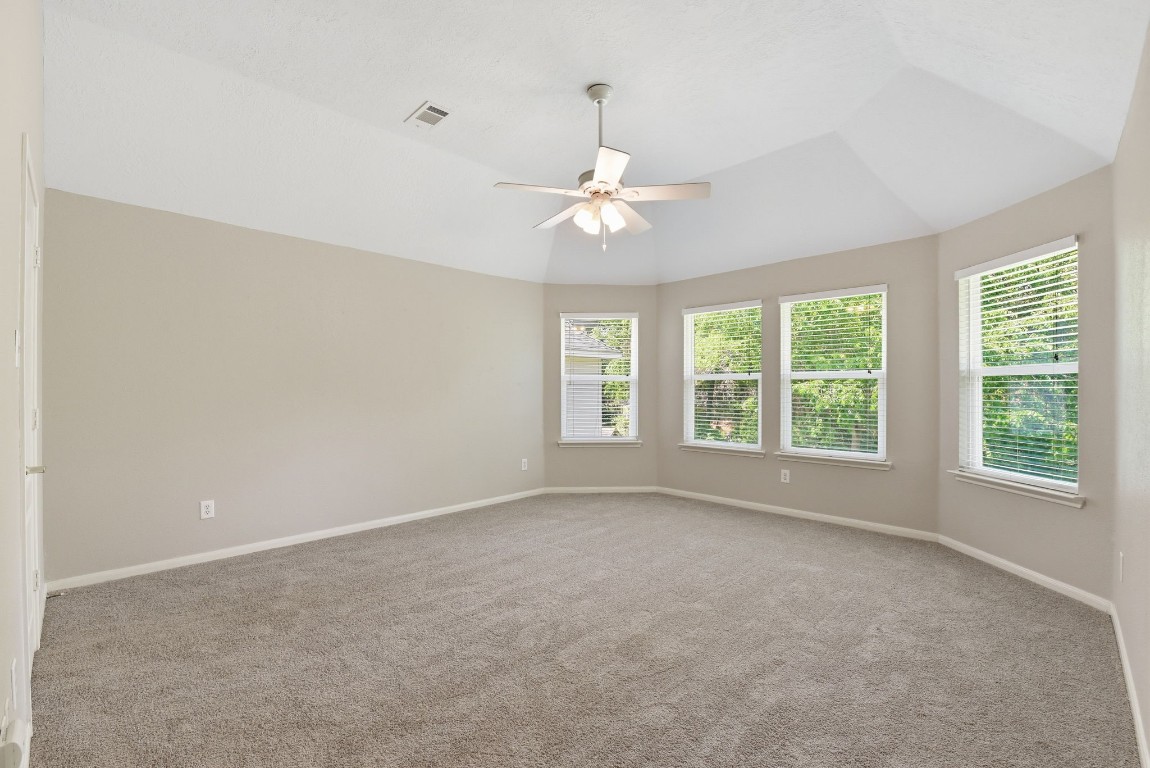 3414 Hackberry Court Spring, TX 77388 - Photo 44 of 50 This huge gorgeous room is bedroom number 5! Located upstairs, this bedroom has so many windows looking out to the backyard, fresh paint, ceiling fan, carpet replaced April 2026!