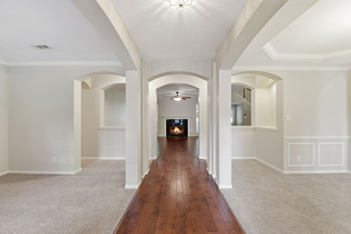 3414 Hackberry Court Spring, TX 77388 - Photo 5 of 50 As you enter the formal dining is to your right and the formal living (or home office or flex space) is to your left Lovely wood floors in the entry and on into the family room. Carpet replaced in April 2026, fresh paint.