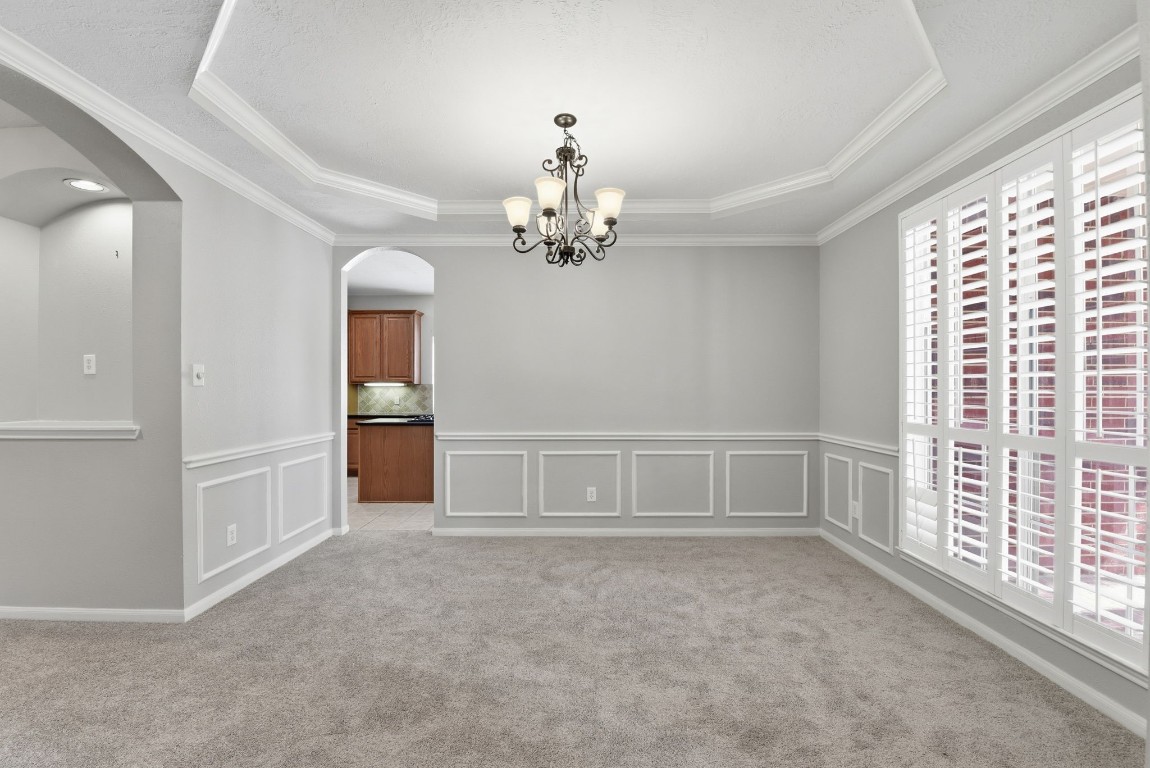 3414 Hackberry Court Spring, TX 77388 - Photo 8 of 50 The formal dining room is to your right as you enter the home. It has carpet that was replaced in April of 2026, fresh paint, white wooden shutters, crown molding and plenty of space for your largest dining set.