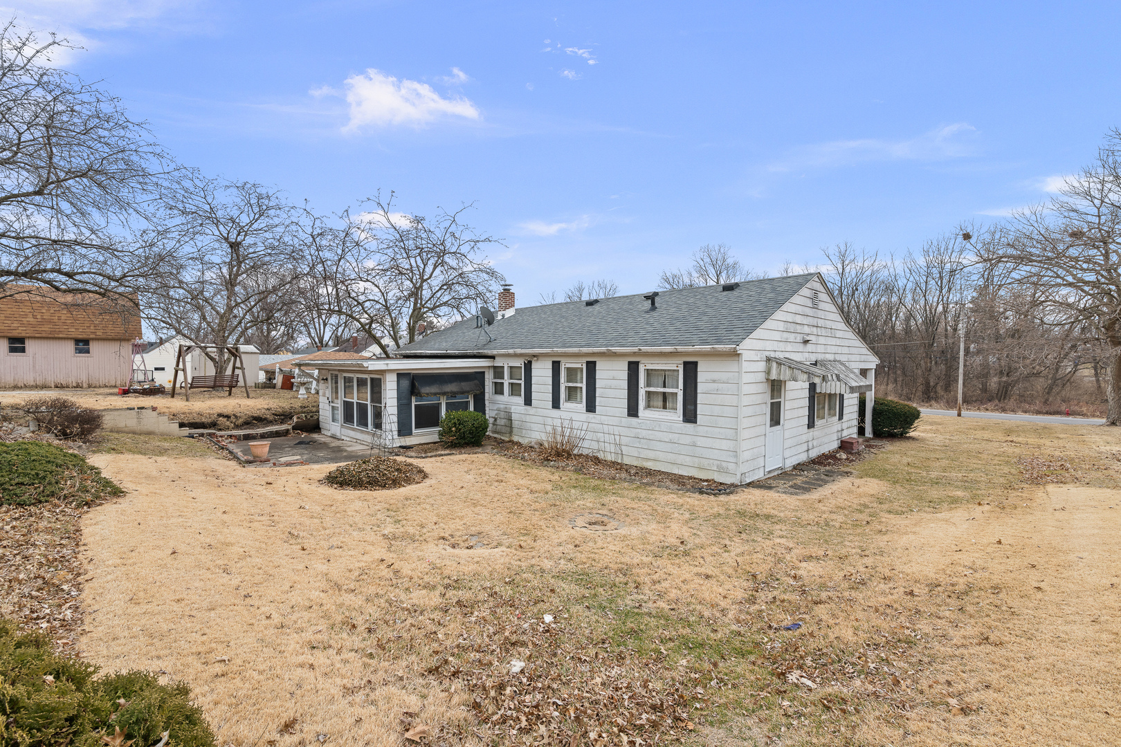 124 East Mill Street Kewanee, IL 61443 - Photo 17 of 21 a view of a house with a yard covered in snow