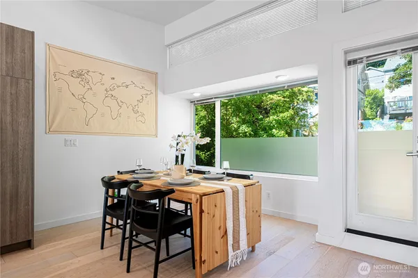 a view of a dining room with furniture window and outside view