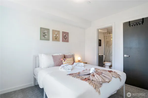 a bedroom with furniture and a window