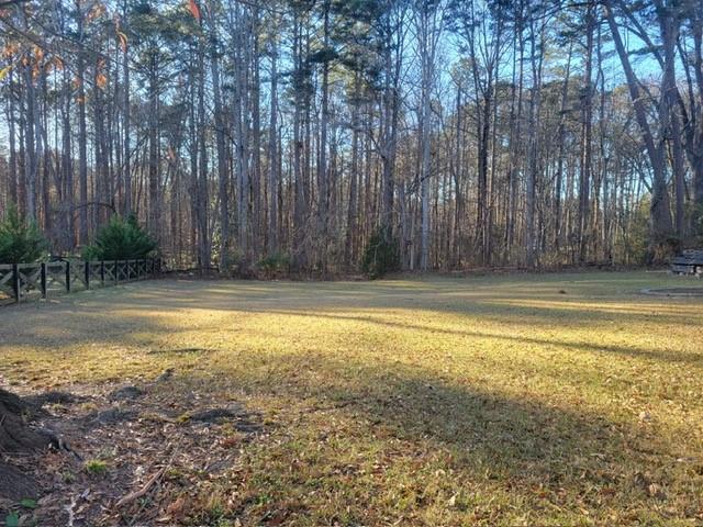 5012 Suwanee Dam Road Suwanee, GA 30024 - Photo 11 of 13 a view of swimming pool with large trees