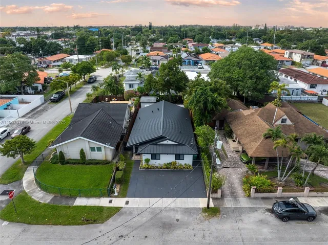 an aerial view of a house with garden