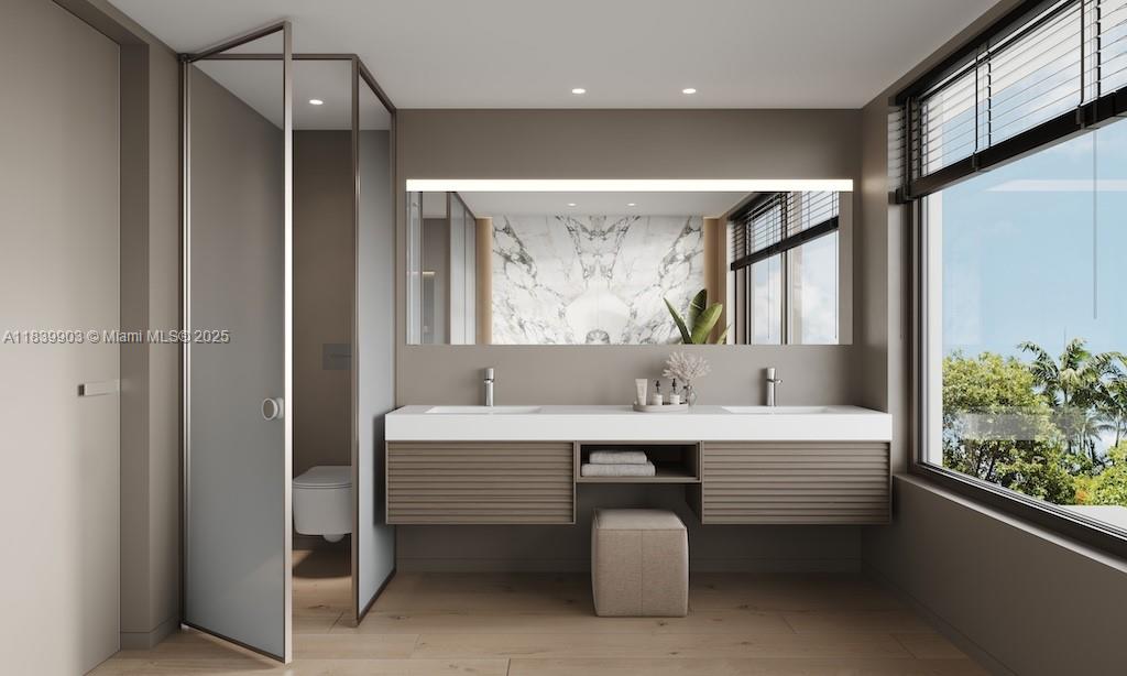 1709 Jefferson Avenue, Unit TH08 Miami Beach, FL 33139 - Photo 10 of 16 a bathroom with a double vanity sink mirror and bathtub