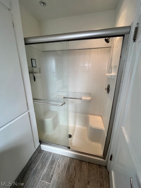 9660 Repp Road West Salem, OH 44287 - Photo 20 of 28 Bathroom featuring wood-type flooring and an enclosed shower