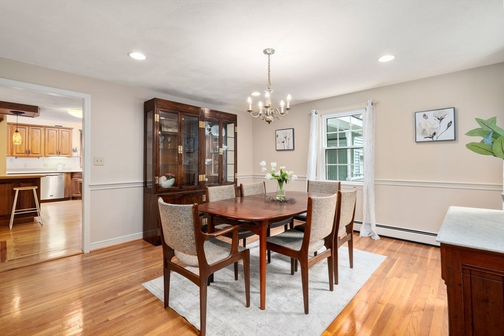 19 Brady Loop Andover, MA 01810 - Photo 11 of 35 a view of a dining room with furniture and wooden floor
