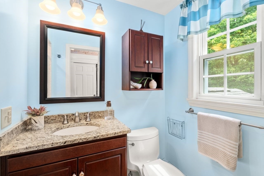 19 Brady Loop Andover, MA 01810 - Photo 21 of 35 a bathroom with a granite countertop sink and a toilet