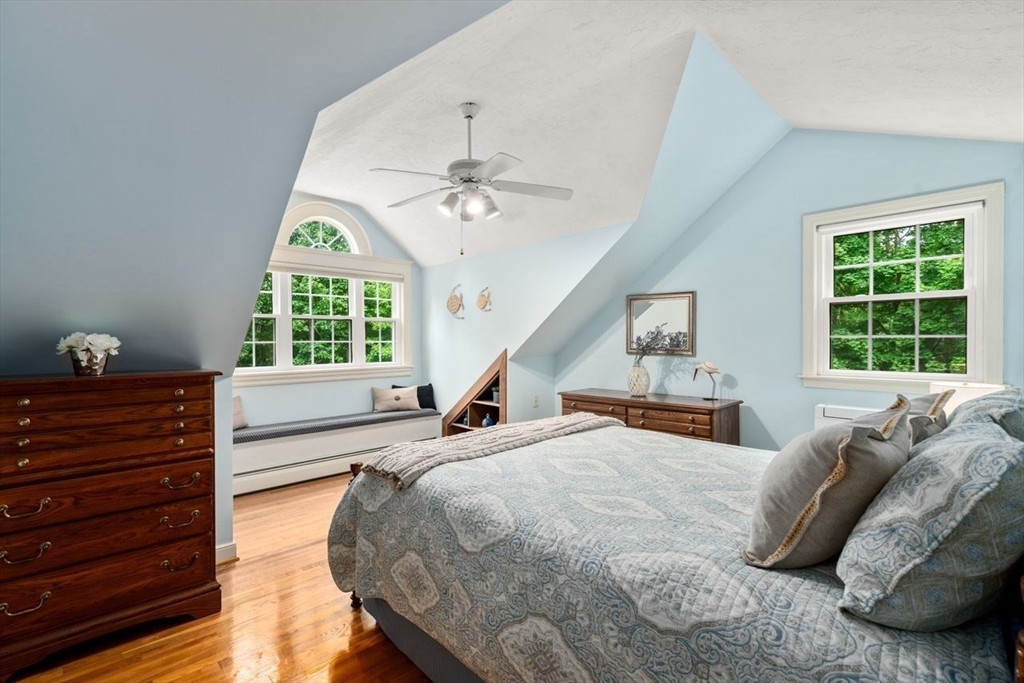 19 Brady Loop Andover, MA 01810 - Photo 22 of 35 a bed sitting in a bedroom next to a window