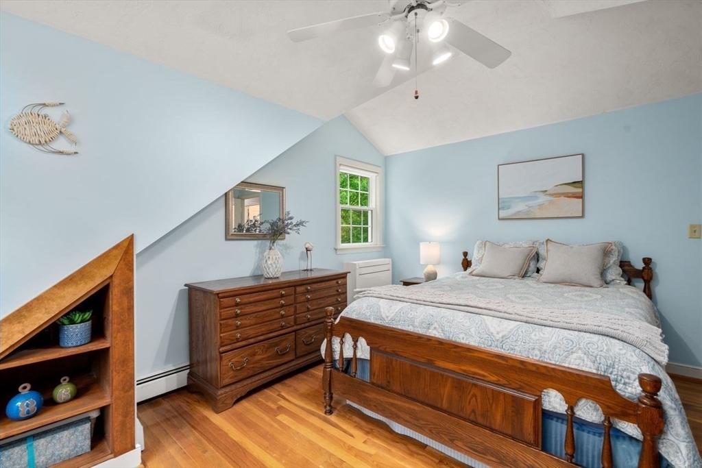19 Brady Loop Andover, MA 01810 - Photo 23 of 35 a bedroom with a bed and a dresser in it