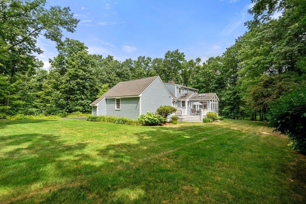 19 Brady Loop Andover, MA 01810 - Photo 32 of 35 a front view of a house with yard and green space