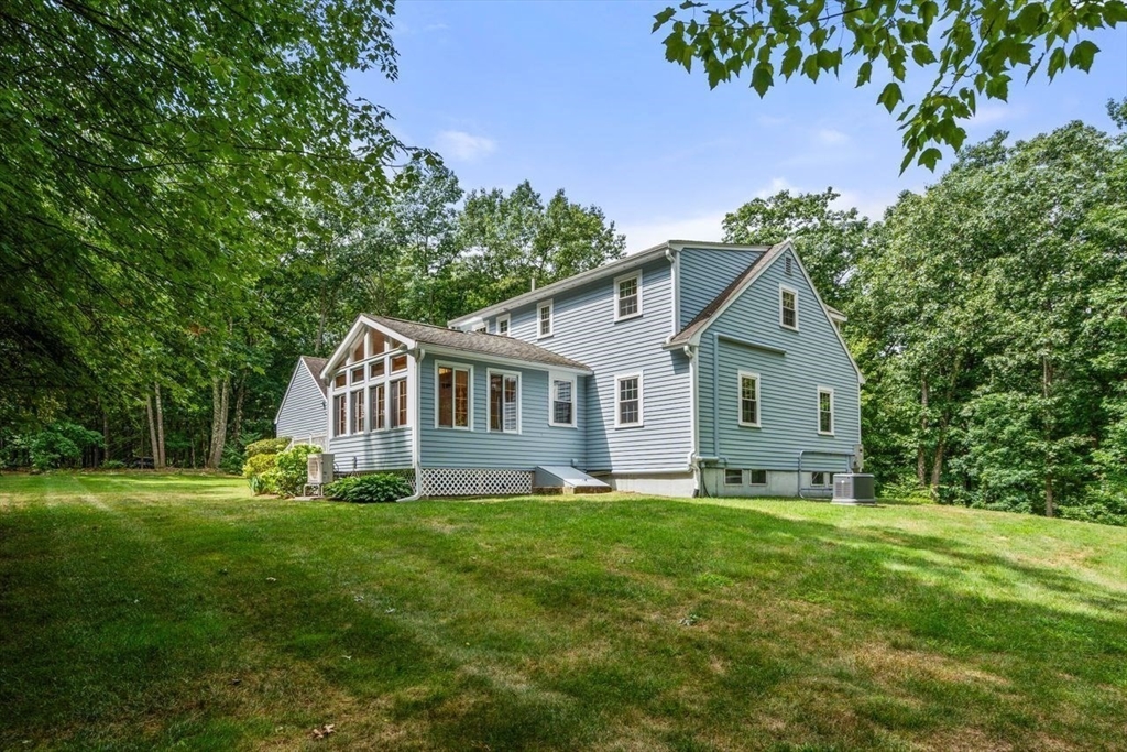 19 Brady Loop Andover, MA 01810 - Photo 33 of 35 a front view of a house with garden
