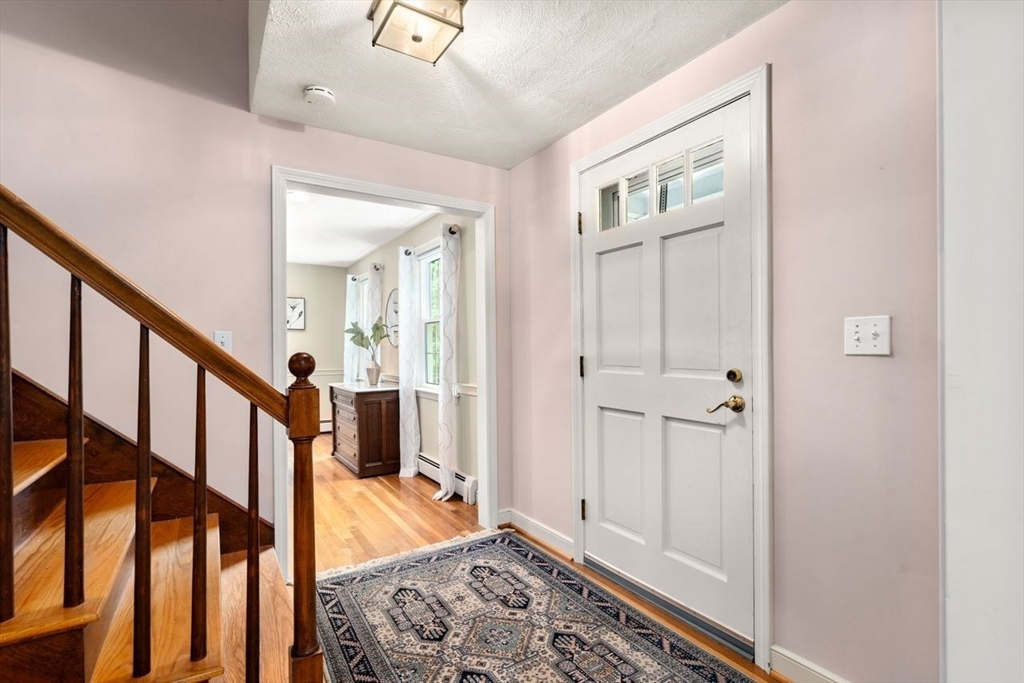 19 Brady Loop Andover, MA 01810 - Photo 4 of 35 a view of an entryway with wooden floor