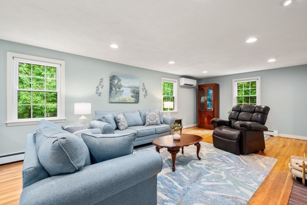 19 Brady Loop Andover, MA 01810 - Photo 5 of 35 a living room with furniture and a large window