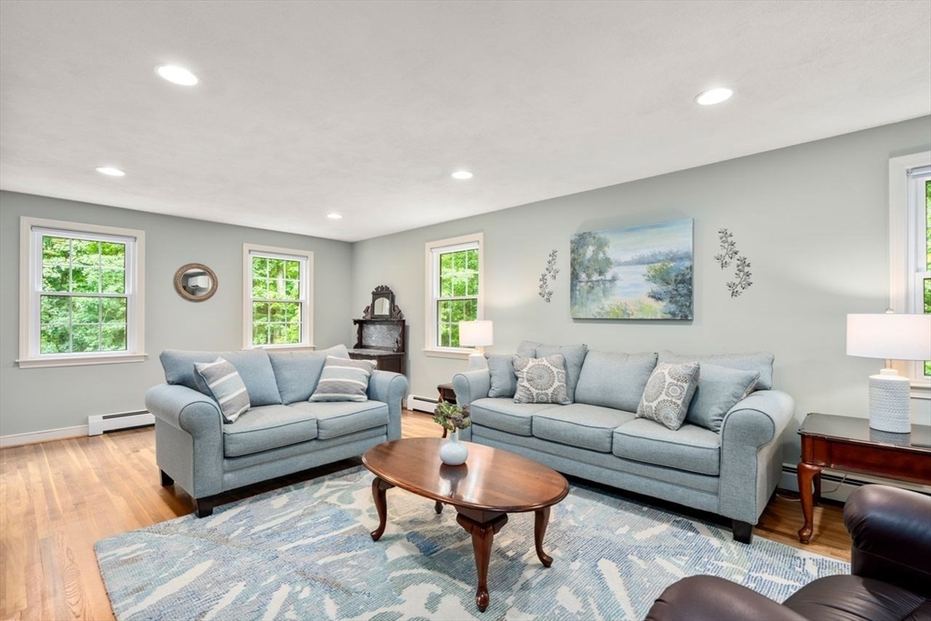 19 Brady Loop Andover, MA 01810 - Photo 6 of 35 a living room with furniture and a large window