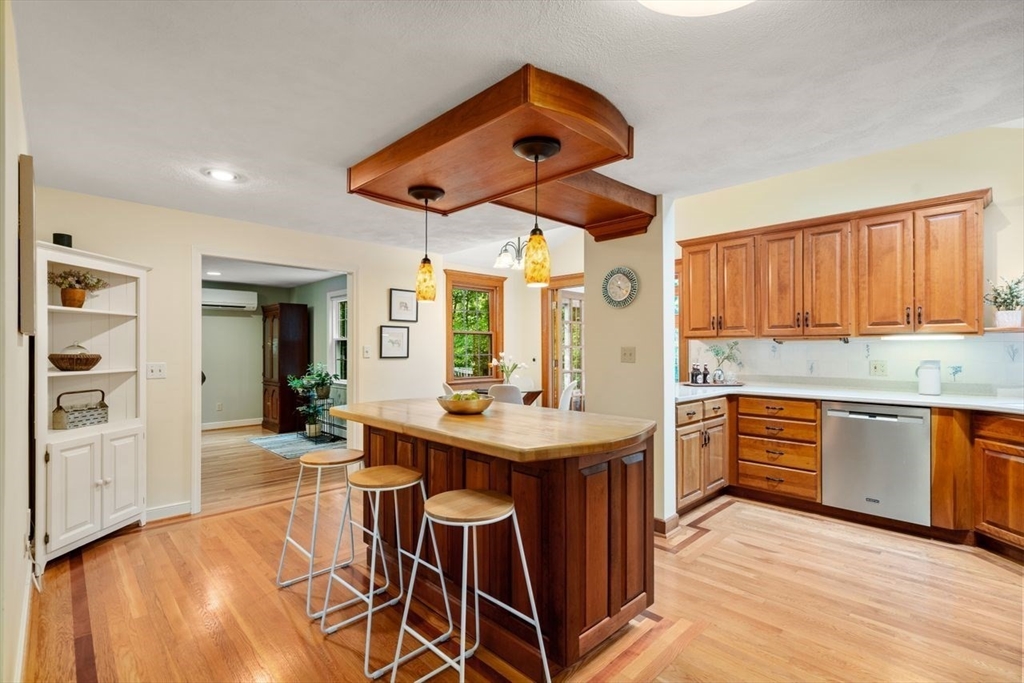19 Brady Loop Andover, MA 01810 - Photo 8 of 35 a kitchen with stainless steel appliances granite countertop a sink and cabinets