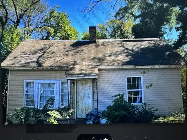 a view of a house with a garden