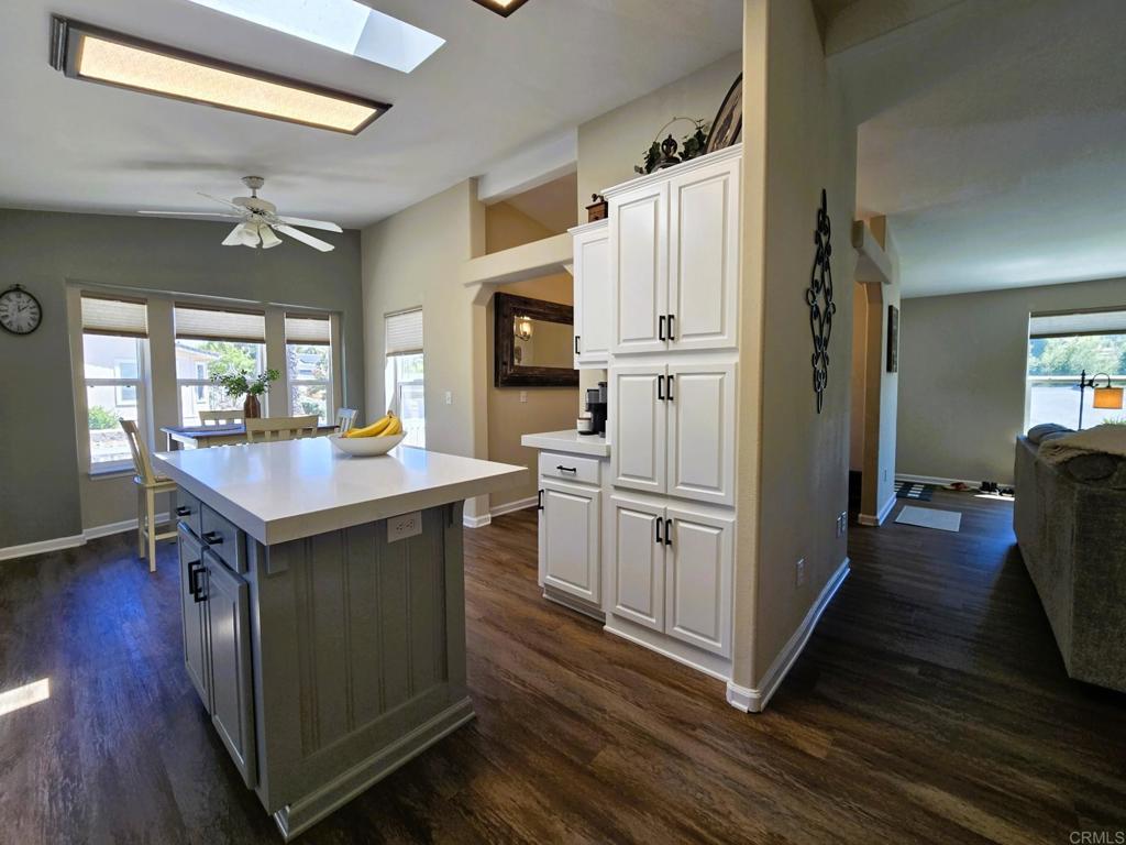 2239 Black Canyon Road, Unit 55 Ramona, CA 92065 - Photo 14 of 38 a kitchen with white cabinets and stainless steel appliances