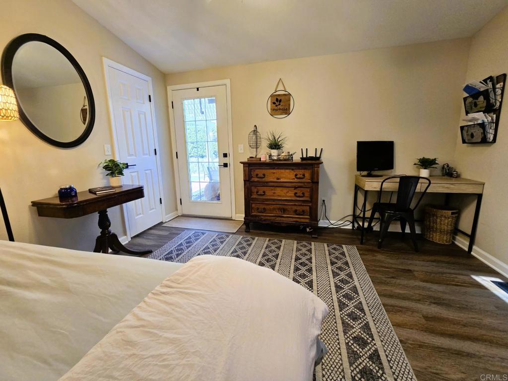 2239 Black Canyon Road, Unit 55 Ramona, CA 92065 - Photo 17 of 38 a bedroom with a bed and a desk