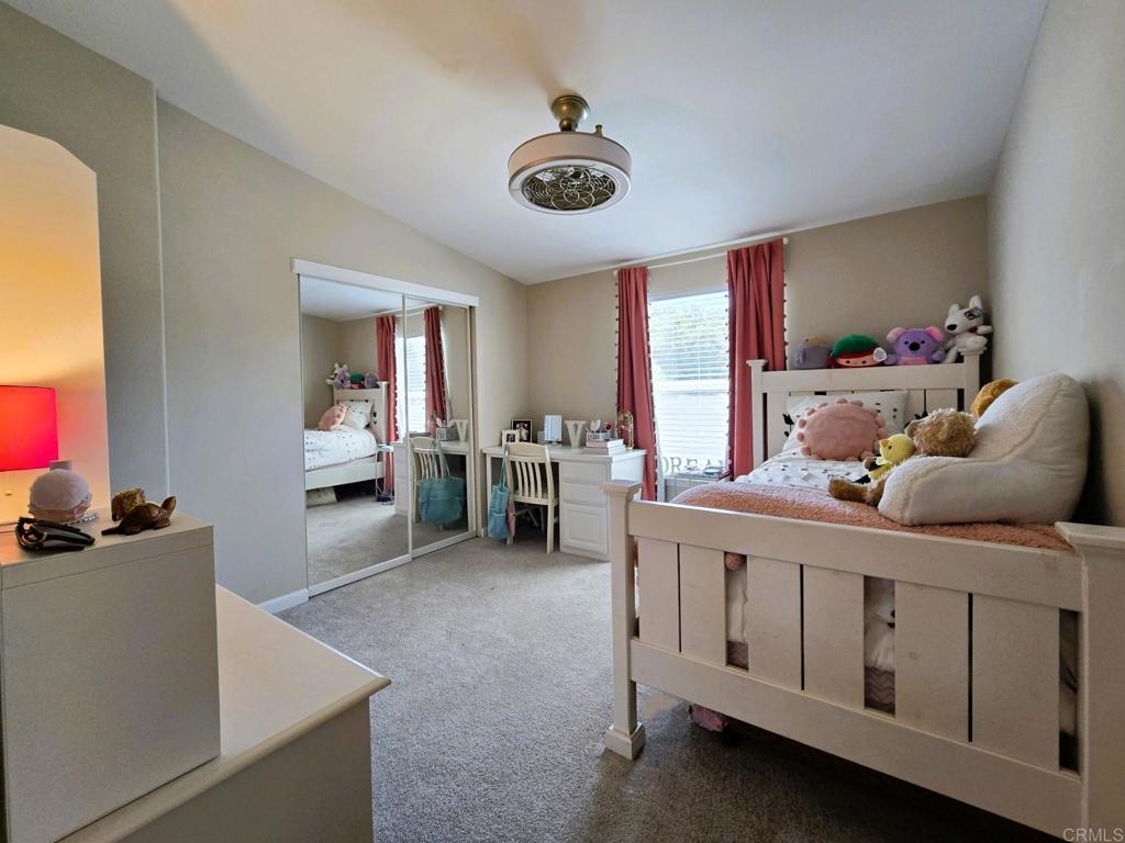 2239 Black Canyon Road, Unit 55 Ramona, CA 92065 - Photo 19 of 38 a bedroom with furniture and a window