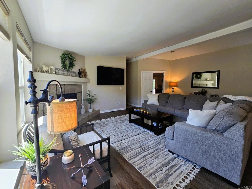 2239 Black Canyon Road, Unit 55 Ramona, CA 92065 - Photo 3 of 38 a living room with furniture and a flat screen tv