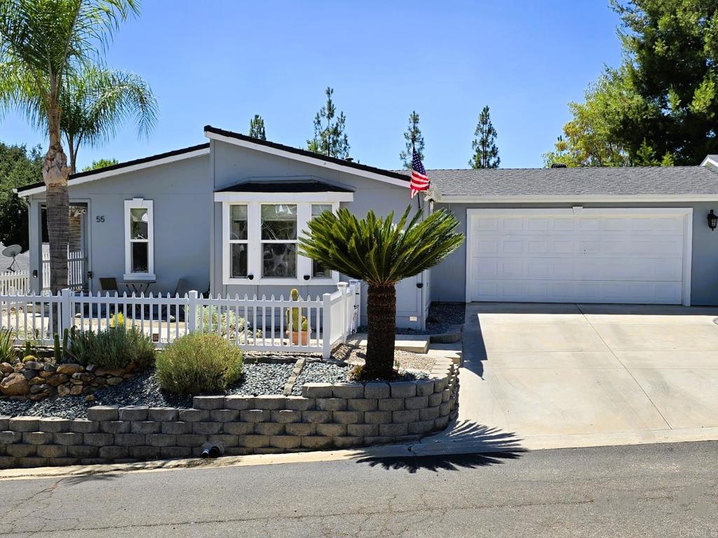 2239 Black Canyon Road, Unit 55 Ramona, CA 92065 - Photo 36 of 38 a front view of a house with garden