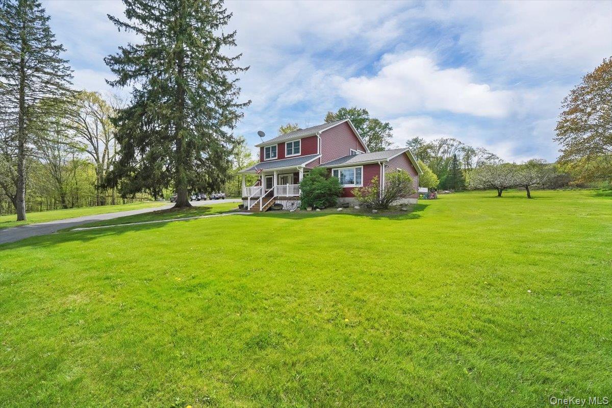 818 Winterton Road Middletown, NY 10940 - Photo 15 of 15 a view of a house with a big yard and large trees