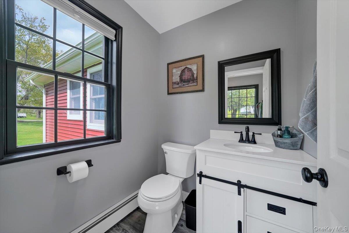 818 Winterton Road Middletown, NY 10940 - Photo 6 of 15 a bathroom with a toilet sink and mirror