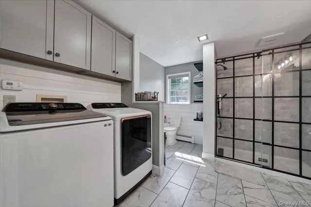 a utility room with dryer and washer